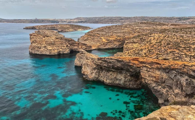 Coastal Ferry Cruise to The Blue Lagoon (Comino Island) - Swimming in crystal-clear water, plus the optional caves speedboat