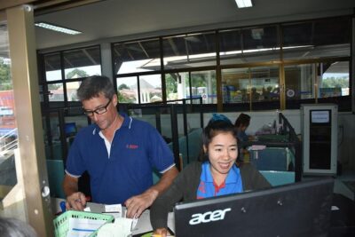 Koh Samui Airport to Koh Phangan by Shared Minivan and Seatran Discovery Ferry - Pickup at Samui Airport: The Samui Accom Counter Detail