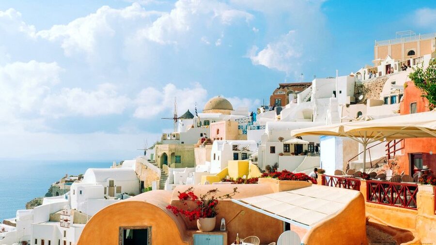 Santorini Guided Day Trip From Crete with Ferry Tickets - The volcanic setting: optional volcano boat tour and warm-spring reality