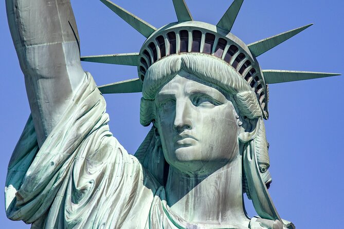 Statue of Liberty & Ellis Island Guided Tour with Ferry Transfers - Liberty Island on the first ferry: the Statue from several angles